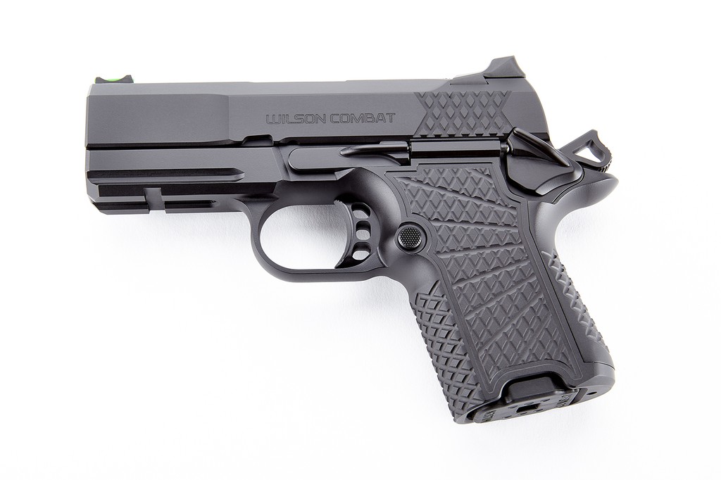 Wilson Combat SFX9 solid frame 1911 handgun showcasing aluminum grip and fluted bull barrel.